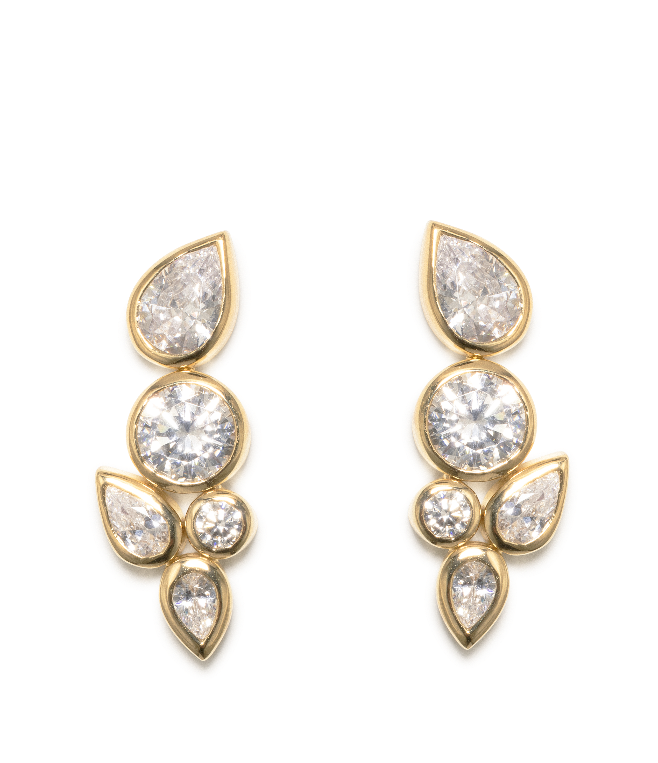A pair of gold drop earrings featuring round and teardrop-cut clear gemstones, set against a plain white background.
