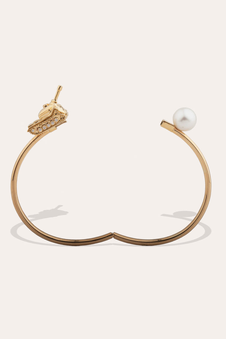 A Portrait of the Twentieth Century - 18 Carat Gold, 0.123ct Diamond and South-Sea Pearl Bangle